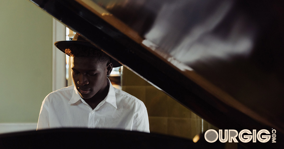 man practicing piano