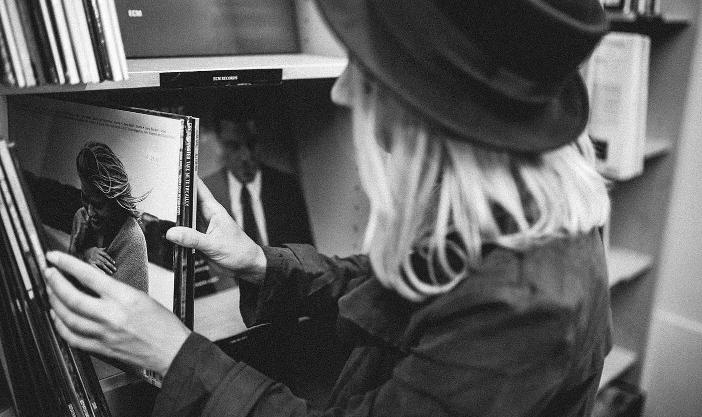 woman selecting vinyl albums in a store