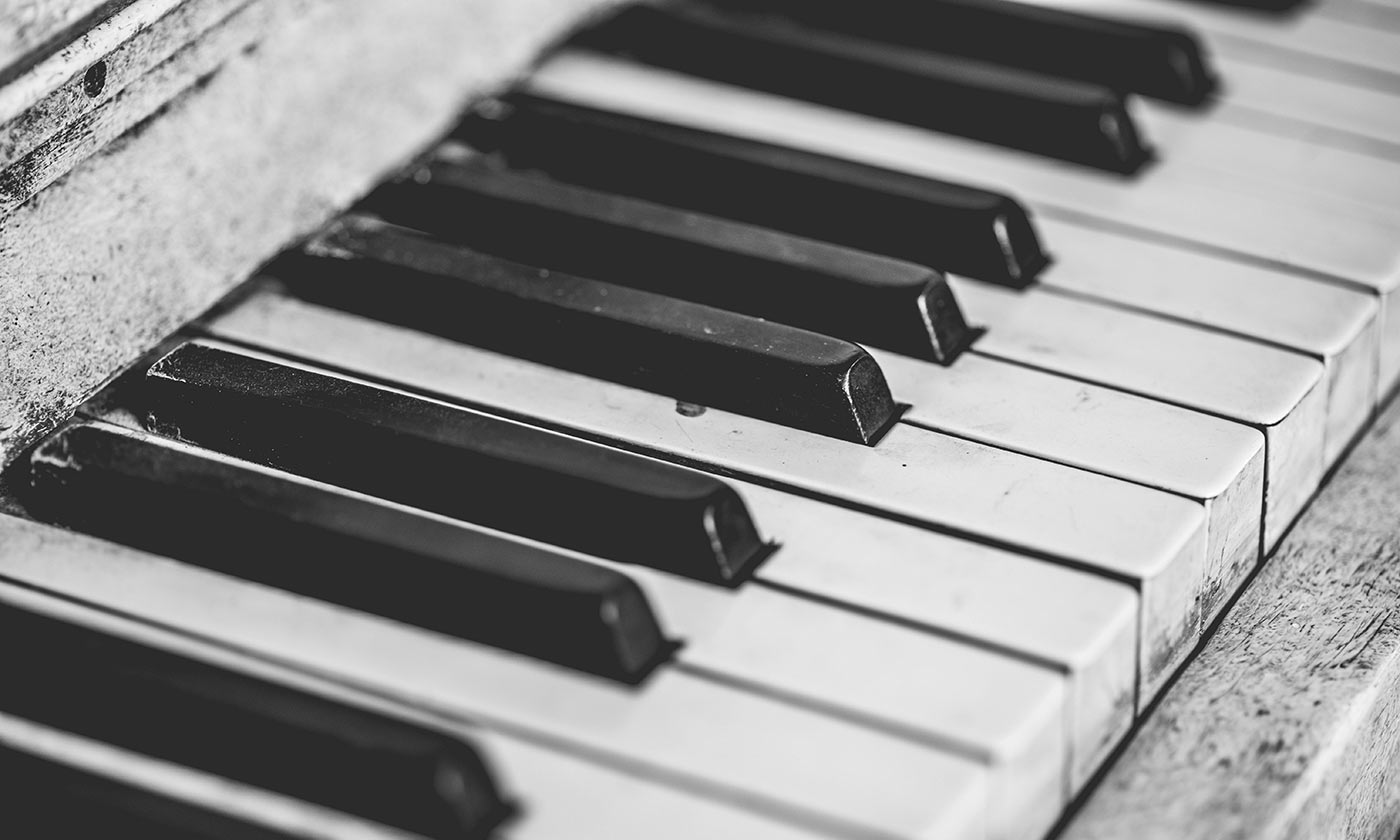 antique well used piano