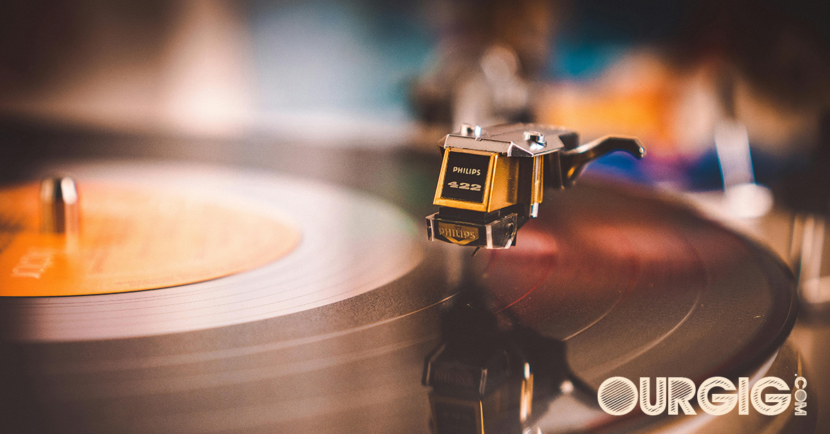 colorful photo of vinyl album playing on turntble