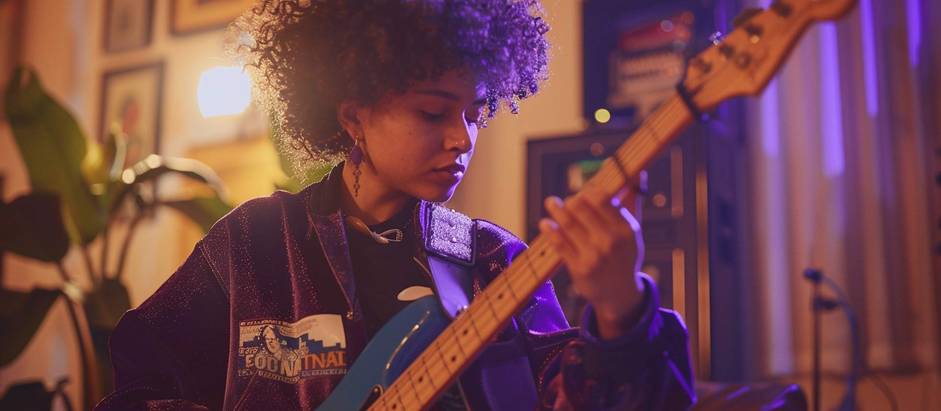 young woman playing electric bass