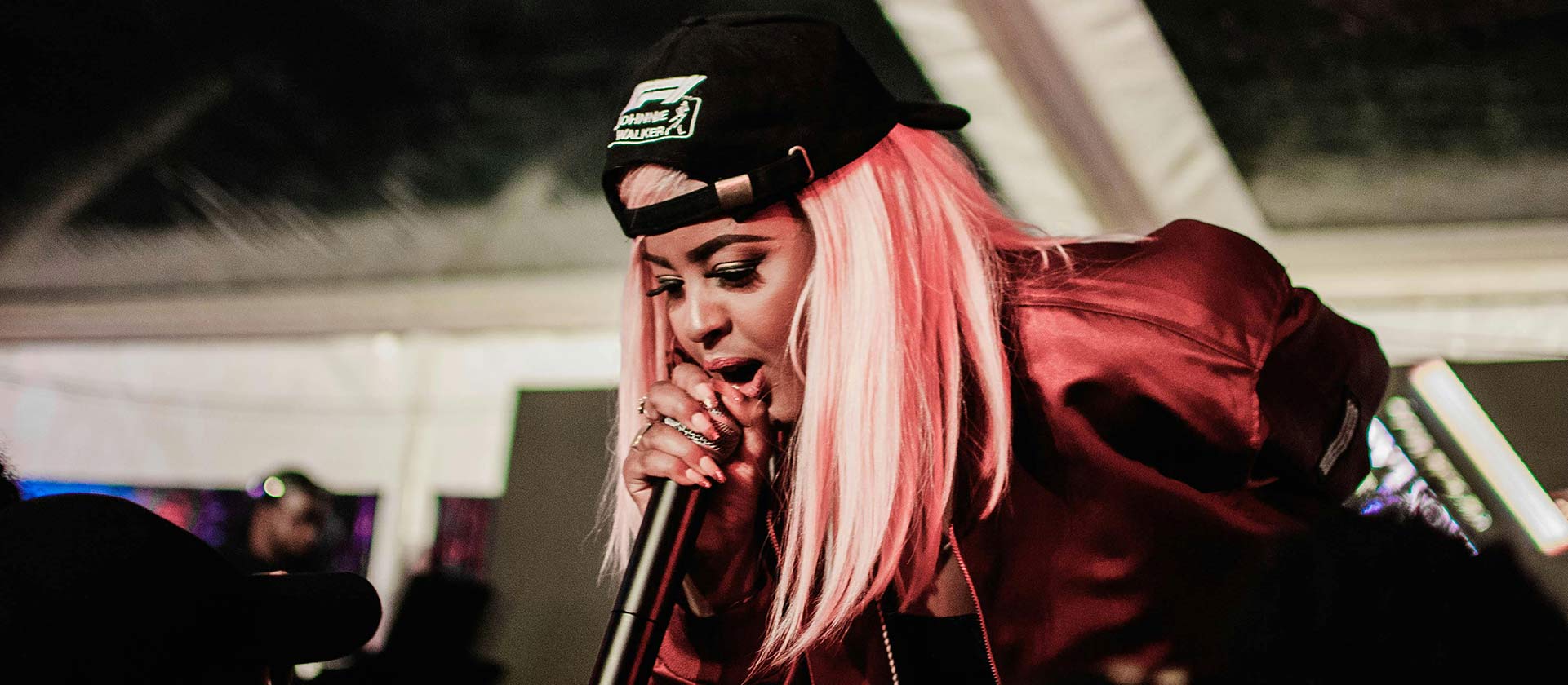female hip-hop artist performing on state