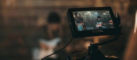 camera recording a live music performance