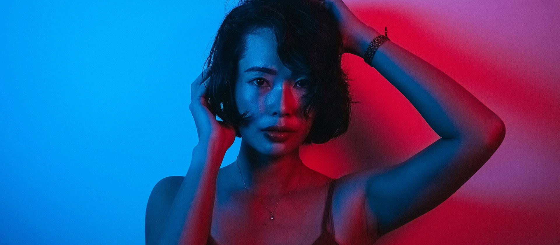 woman under colorful lights