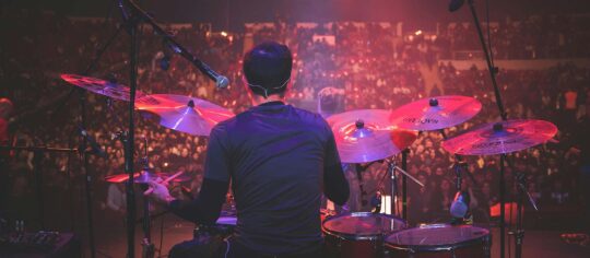 drummer in concert from behind