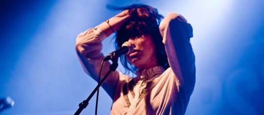 woman artist performing on stage