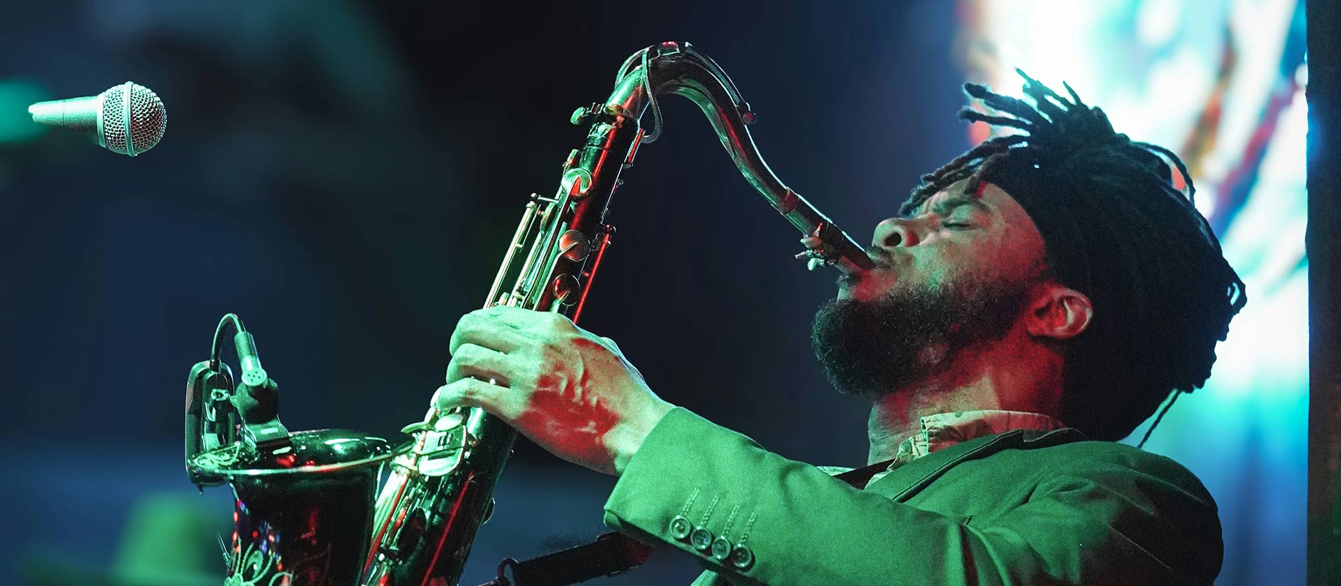 man playing saxophone in a jazz club