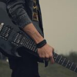 guitar player in field