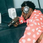 man podcasting in his pajamas