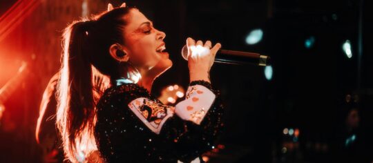 woman vocalist performing on stage