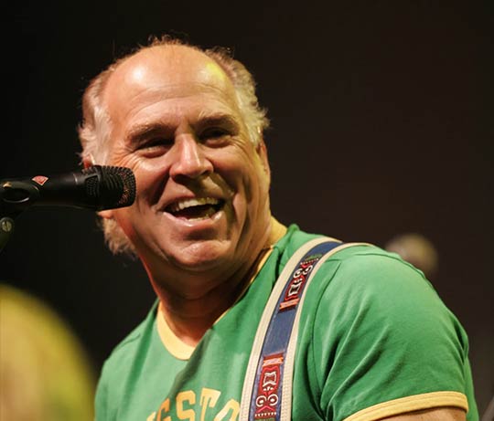 Jimmy Buffet performing at a benefit concert