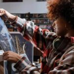 woman looking at Vinyl albums in a record store