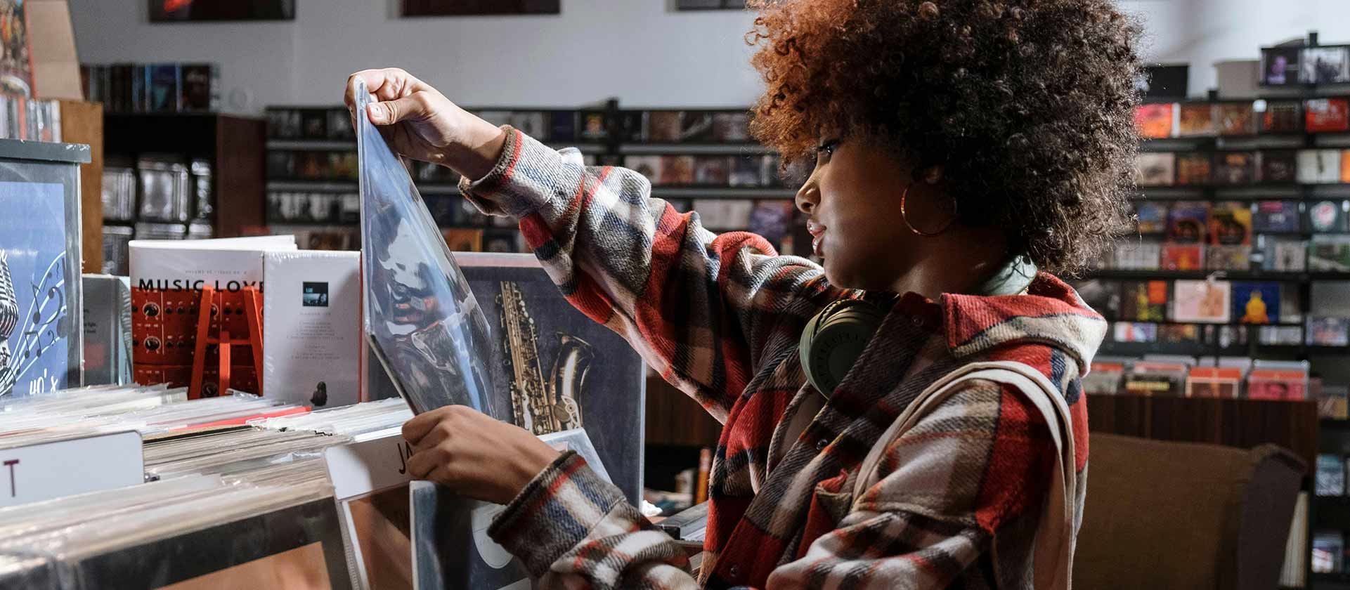 woman looking at Vinyl albums in a record store