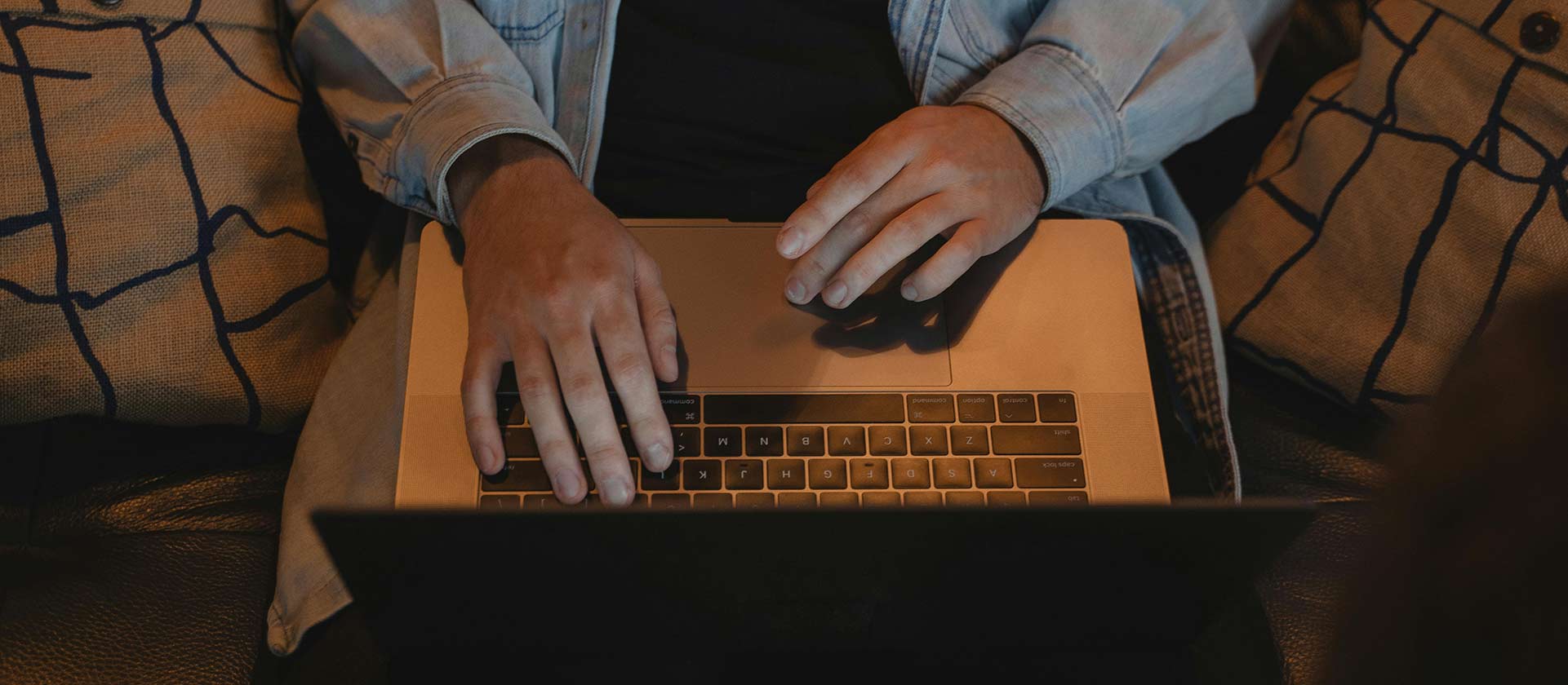 man using computer at night