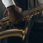 man holding saxophone