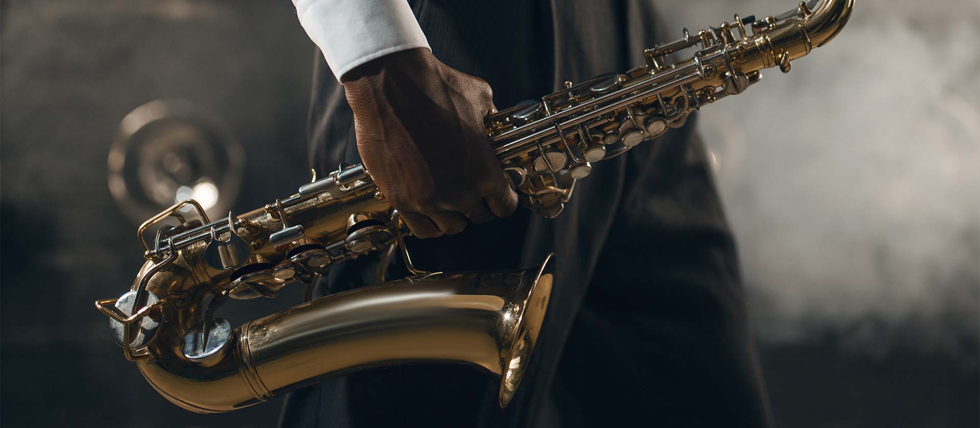 man holding saxophone