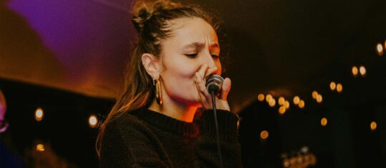 female artist live on stage