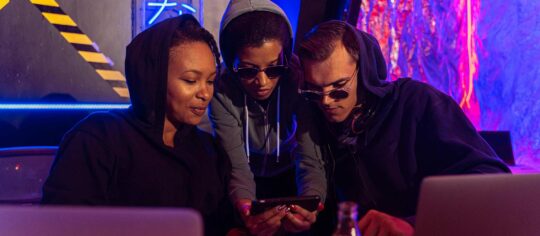 friends looking at social media on a phone