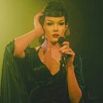 female artists on stage in vintage clothes