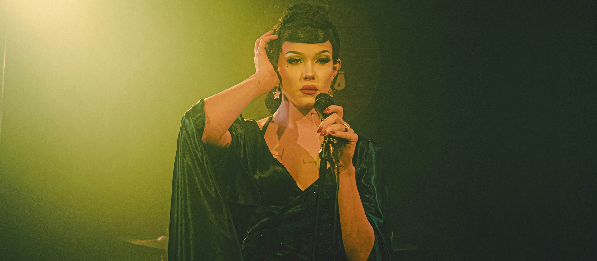 female artists on stage in vintage clothes