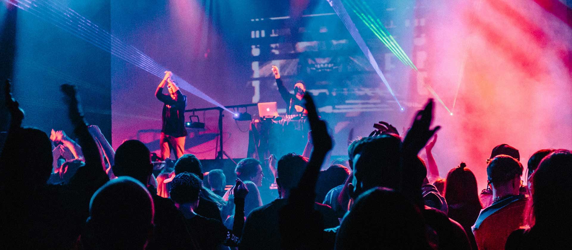 female singer performing in club with DJ