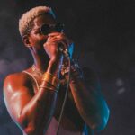 male vocalist performing on stage