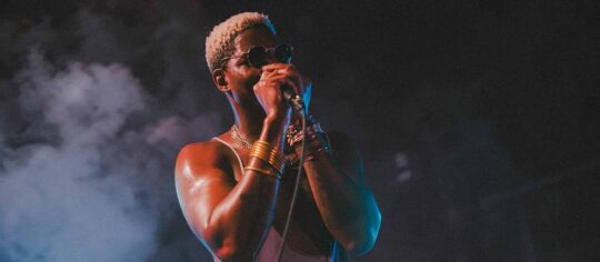 male vocalist performing on stage