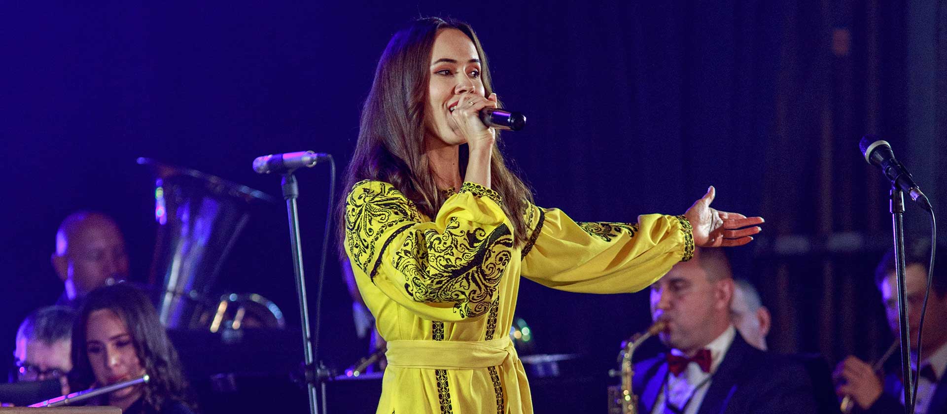female vocalist performing with orchestra