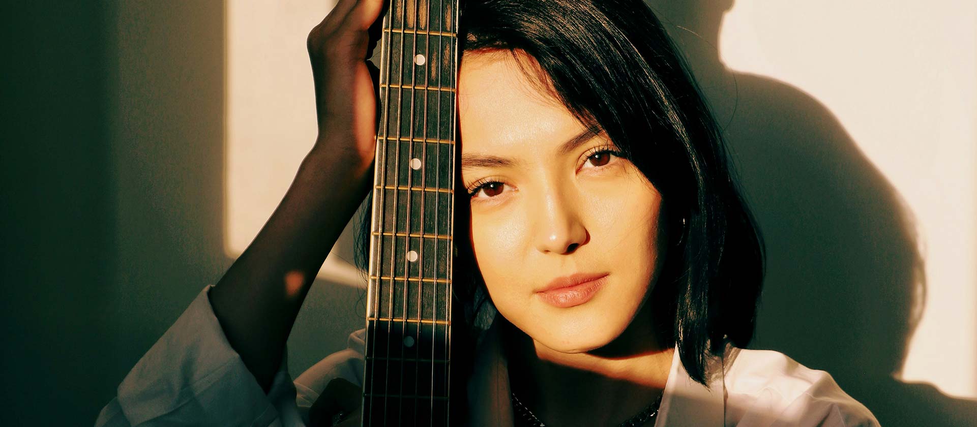 female artist posing with Guitar