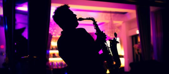 sax player performing in jazz club