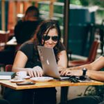 marketing team working on strategy in coffee shop